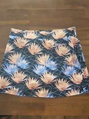 Pebble Beach Floral Print Skort with Peach & Blue Blooms and built-in shorts.